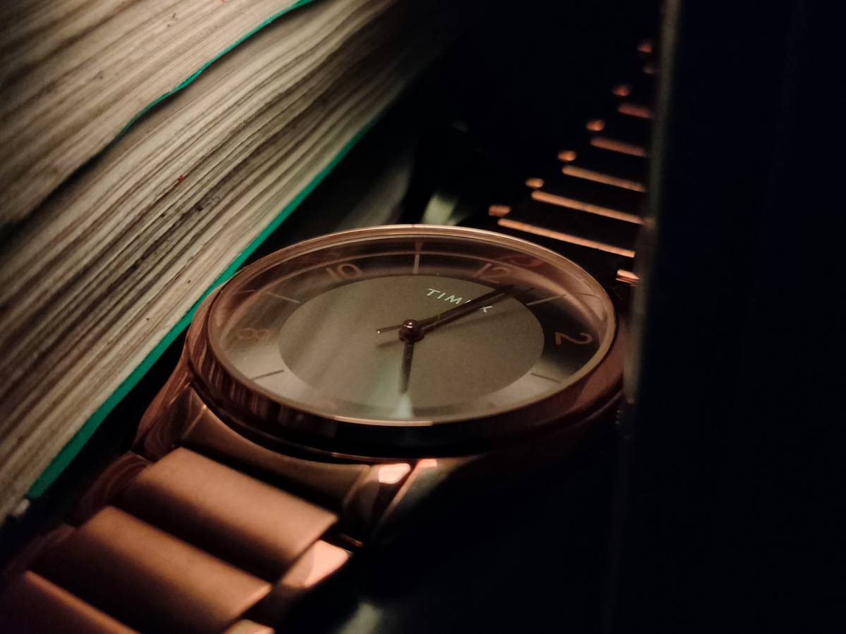 Close-up macro photo of three limited run watch colors side by side: matte charcoal, iridescent peacock, and sunburst burgundy — all labeled with batch codes and spectral measurement tags, showing limited run watch colors under calibrated lighting